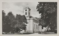 Kirken fra sørvest. Foto: Carl Normann (1922).