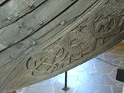 Osebergskipet, detalj fra stavnen. Foto: Olve Utne (2008)