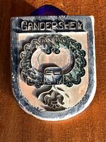 Funnet i den nordligste av de tre bunkersene rundt 1960, bunkersene ble fjernet ved anlegg av den nye Kirkeveien noen år senere: Plakett fra Gandersheim, en by sør for Hannover med historie tilbake til det 13. århundre.