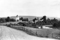 Kirken og prestegården sett fra Langebru