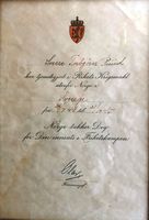 Tjenestebevis for å ha deltatt i Rikets Krigsmakt utenfor Norge 25.07.1944-31.10.1945, signert Forsvarssjef Olav.