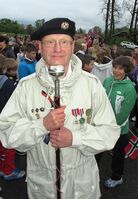 Thoralf Dehli (født 17. oktober 1942 i Oslo) fra Asker ble student i 1961 og cand.theol. fra Universitetet i Oslo i 1969 og praktikum året etter. Så ble han feltprest med tjeneste i Ramsund. Som frontfigur i korpset Gutta på Skaugum i Asker nektet den tidligere soknepresten i Østenstad og Heggedal å bli omtalt som tamburmajor, han var tamburkaptein, i tråd med sin høyeste militære grad. Bildet er tatt 17.mai 2012. Foto: Svend Aage Madsen.